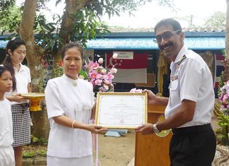 Khao Bai Sri Principal Ketsra Phuaknang (left) thanks Singapore Navy Lt. Cmdr. Sam Abey for his help in rebuilding the school.